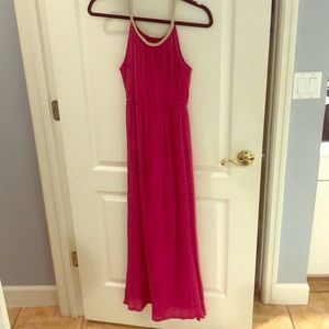 Elegant, fuchsia maxi with gold braid detail.
